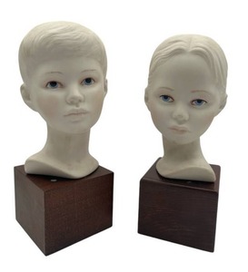 lot 32 image: Vintage Cybis 10-inch Porcelain Boy and Girl Busts on Wood Stands