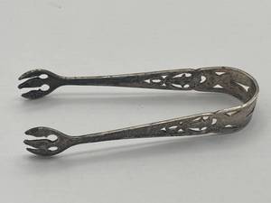 lot 92 image: Vintage Webster Sterling Silver Sugar Tons (12.2 grams), 3-inches long