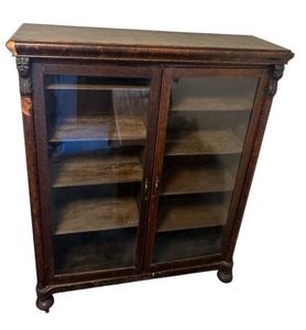 lot 134 image: Antique Two-Door Bookcase with Adjustable Shelves and Locking Doors (with Key), Rolling Wheels - 48.5 W X 60.5 T x 15 D)