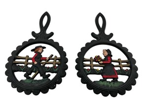 lot 204 image: Pair of Vintage DALECRAFT Painted Cast Iron Trivets of Amish Man & Woman (4.75 x 8)