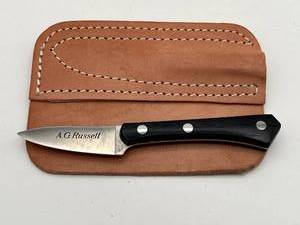 lot 280 image: Vintage A.G. Russell Woodswalker Knife with Leather Sheath (2.5 Blade)