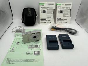lot 409 image: Canon PowerShot SD1000 Digital ELPH 7.1MP Digital Camera - $192 Retail Price