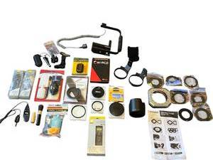 lot 414 image: Huge Camera Accessories Lot - New Nikon MC-36 Remote Cord, BW Filters, Nikon HB-38, Polaroid 16 LED Ring Light (PLMRL16), Cleaning Kits, Stroboframe, and More