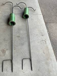 lot 631 image: Two Sheperd Hooks with Squirrel and Racoon Baffles for Bird Feeding