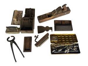 lot 669 image: Antique & Vintage Tools - Tap & Die Set, Antique Hand-Made Drill Bit Box w Bits, Antique Hammer Hatchet Head w Nail Puller, Sharpening Stones, and Block Plane