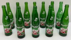 lot 114 image: Vintage Early Mountain Dew Soda Bottles