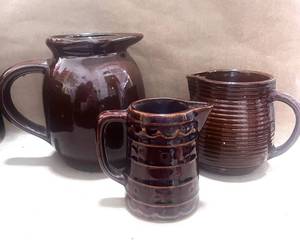 lot 85 image: Redware Pitcher, Monmouth Pottery Pitcher and Marcrest Daisy and Button Pitcher