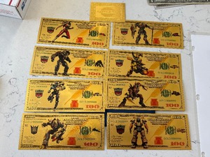 lot 130 image: Gold 24K Transformers $100 Dollar Bills