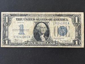 lot 131 image: 1934 Blue Seal $1 Dollar Silver Certificate Funnyback