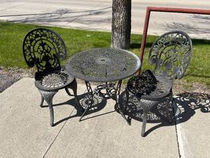 lot 44-D2025 image: Cast Iron Bistro Table and 2 Cast Iron Chairs