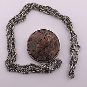 lot 53 image: 1922 Peace Silver Dollar w Chain Attached