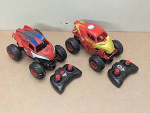 lot 122 image: Spiderman & Iron Man Monster Jam Remote Control Cars - 124 Scale Cars