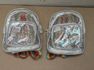 lot 102 image: Set of 2 Mini Glitter Back Packs - Clear