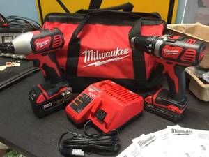 lot 153 image: Brand New Milwaukee M18 Cordless Impact & Drill Set