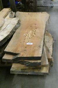 lot 11 image: Stack of 7 pieces liverough cut lumber not sure what type