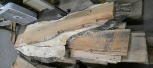 lot 12 image: Stack of 10 pieces liverough cut lumber not sure what type