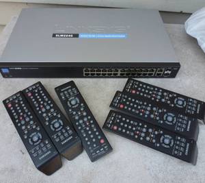 lot 65 image: group of electronics - switch, 6 remotes, usb drives, webcam, laptop drives