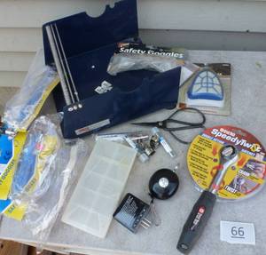 lot 66 image: warehouse items, tapelabel roll holder, safety goggles, ratchet, bearings, dust mask, zip extending key ring, soldering iron heads