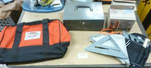 lot 147 image: New tool bag, speed squares, outdoor security lights and change box