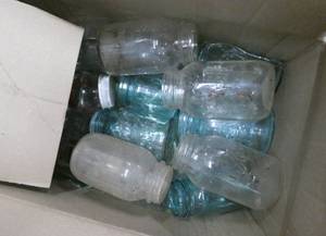 lot 182 image: Large box of about 25 canning jars blue and clear