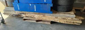 lot 27 image: Stack of 6 pieces liverough cut lumber not sure what type