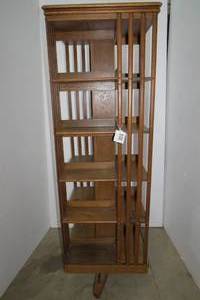 lot 6 image: Revolving 5 tiered bookshelf on rol...