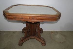 lot 31 image: Wood table  heavily carved with mar...