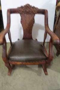 lot 36 image: Oversized carved leather seat rocke...
