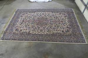 lot 39 image: Area rug, done in navys and off-whi...