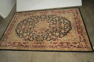 lot 87 image: Area rug with cranberry and blacks,...