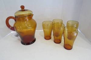 lot 111 image: Amber glass pitcher and glasses, ca...