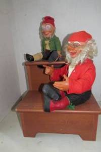 lot 196 image: Gnome and elf sitting on steps, one...