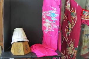 lot 200 image: Asian clothing and lamp shades...