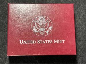 lot 86 image: 1983 US OLYMPIC COMMEM SILVER DOLLAR