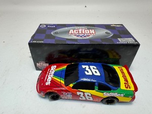 lot 135 image: Derrike Cope #36 Skittles 1997 Pontiac