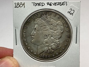 lot 22 image: 1884 Morgan Silver Dollar