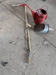 lot 144 image: Red Oil Can, Feed Scoop, Vintage Fishing Pole