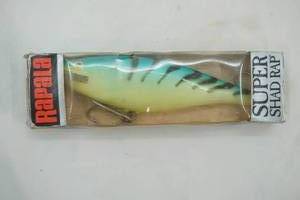 lot 265 image: Vintage Rapala Super Shad Rap in original packaging 7