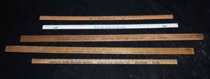 lot 15 image: Local Business YardMeter Sticks  Hennes Feed Mill, Fidelity State Bank & More