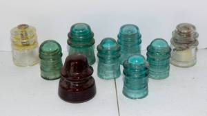 lot 27 image: Nine Vintage Glass Insulators