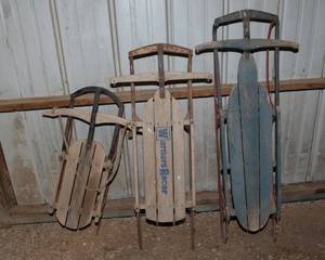 lot 134 image: AnitiqueVintage TaboganSleds -  Set of Three