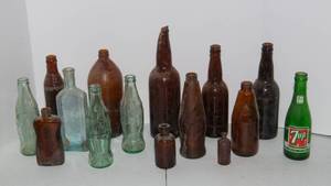 lot 107 image: Vintage Colored Glass Bottles