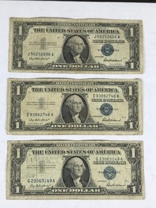 lot 304 image: 3 - 1957 Series Blue Seal 1 Dollar Silver Certificates