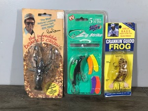lot 388 image: Lot of 3 Fishing Lures in Original Packages - Crankin Guido Frog - Dances Craw - Big Strike