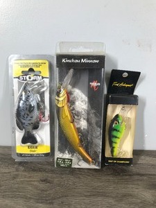 lot 391 image: 3 Fishing Lures in Original Packages -,Kinchou Minnow -,Storm Kickin Slab - Fred Arbogast Bait of Champions