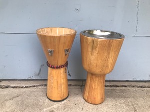 lot 406 image: Djembe Instruments (unsure if that is what they are because the tops are missing) the one has a metal lid that is removable)