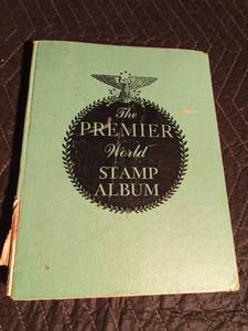 lot 240 image: 1957 Premier world stamp album with many stamps