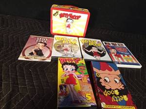 lot 206 image: Betty Boop DVD tin case with DVDs and VHSs