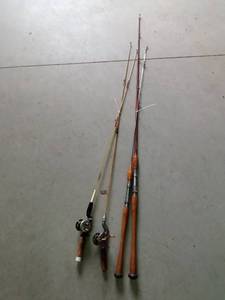 lot 162 image: 3 Vintage fishing rods, 1 steel fishing rod and 2 fishing reels