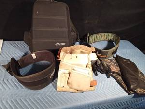 lot 134 image: Pistol holders, ammo belt, safety climbing belt, backpack and tool belt